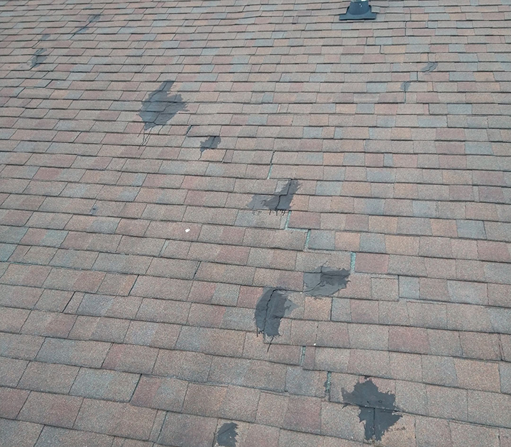  cracked and patched asphalt shingles