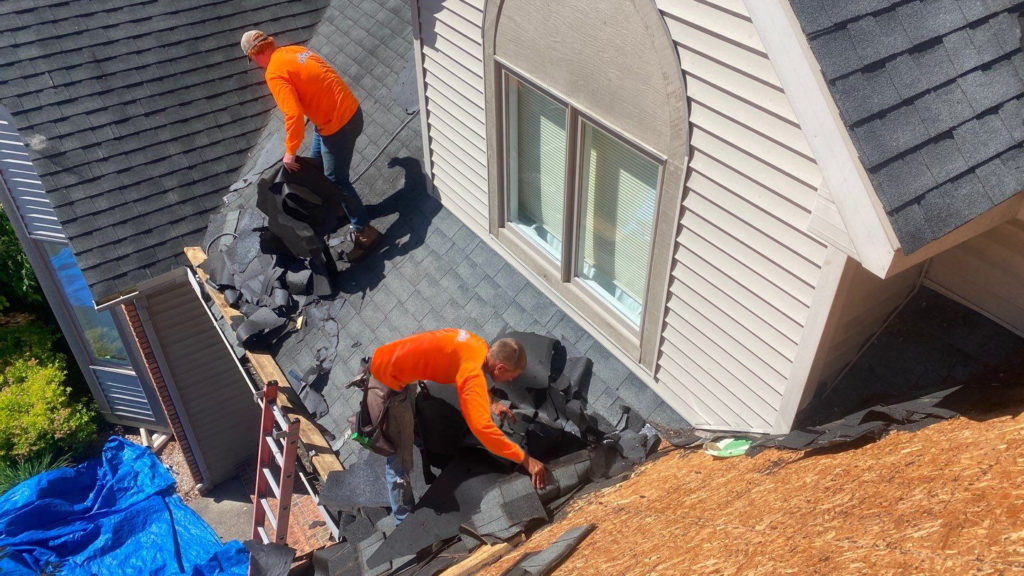 Professional roofers installing a new roof
